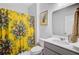 Bright bathroom with a white vanity, decorative shower curtain, and modern fixtures at 3798 Sawmill Ct, Mount Pleasant, SC 29429