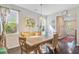 Inviting dining room with hardwood floors, bright windows, and stylish decor at 3798 Sawmill Ct, Mount Pleasant, SC 29429