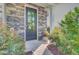 Inviting front door with stone accents and colorful plants, and address 3798 at 3798 Sawmill Ct, Mount Pleasant, SC 29429