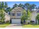 Charming two-story home with a two car garage, nicely landscaped yard, and a mix of stone and siding exterior at 3798 Sawmill Ct, Mount Pleasant, SC 29429