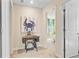 Hallway featuring a sewing machine and a doorway to a bedroom beyond at 3798 Sawmill Ct, Mount Pleasant, SC 29429