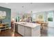 Open kitchen with a large island, stainless steel appliances, and seamless flow to the dining area at 3798 Sawmill Ct, Mount Pleasant, SC 29429