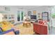 Bright living room featuring cozy seating, wood floors, and a view of the outdoors at 3798 Sawmill Ct, Mount Pleasant, SC 29429