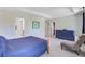 Open main bedroom with ensuite bathroom, walk-in closet, and accent furniture at 3798 Sawmill Ct, Mount Pleasant, SC 29429