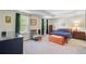 Spacious main bedroom with tray ceiling, two windows, and hardwood furnishings at 3798 Sawmill Ct, Mount Pleasant, SC 29429
