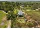 Aerial view of house surrounded by lush green trees with a long driveway at 3810 Marshfield Rd, Johns Island, SC 29455