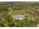 An aerial view showing the home's serene location amongst trees and overlooking picturesque marshland at 3810 Marshfield Rd, Johns Island, SC 29455