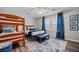 Bedroom featuring bunk beds, bed, and large window with curtains at 3810 Marshfield Rd, Johns Island, SC 29455