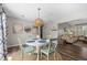 Cozy dining area with a round table, seating for four, and stylish decor at 3810 Marshfield Rd, Johns Island, SC 29455
