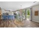 Open concept with the kitchen and dining area with a round table and access to the patio at 3810 Marshfield Rd, Johns Island, SC 29455