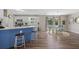 Modern kitchen featuring a breakfast bar, stylish countertops, and an adjacent dining area for easy entertaining at 3810 Marshfield Rd, Johns Island, SC 29455