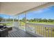 Screened porch with wicker seating and scenic outdoor view at 3810 Marshfield Rd, Johns Island, SC 29455