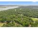 Panoramic aerial view of a lush, green landscape with water features and golf course views at 40 Greensward Rd, Kiawah Island, SC 29455