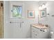 Bathroom with a granite vanity, natural light, and glass-enclosed shower at 40 Greensward Rd, Kiawah Island, SC 29455