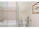 Bathroom featuring a soaking tub with tile surround, frameless shower, and toilet at 40 Greensward Rd, Kiawah Island, SC 29455
