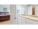 Bathroom with double sink, vanity, and mirror, with a view of bedroom at 40 Greensward Rd, Kiawah Island, SC 29455