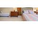Cozy bedroom features warm tones, comfy bed, and lots of storage at 40 Greensward Rd, Kiawah Island, SC 29455