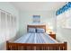 Bedroom with wooden frame queen bed, closet, and curtains at 40 Greensward Rd, Kiawah Island, SC 29455