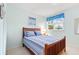 Bright bedroom with a queen bed, matching headboard and footboard, and bright natural light at 40 Greensward Rd, Kiawah Island, SC 29455