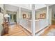 Dining room area with hardwood floors, neutral walls, and an open view to the front door at 40 Greensward Rd, Kiawah Island, SC 29455