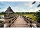Scenic view of a dock leading to a charming waterfront gazebo and a tranquil marsh at 40 Greensward Rd, Kiawah Island, SC 29455
