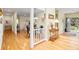 Inviting entryway boasting hardwood floors and a view of the dining area and kitchen at 40 Greensward Rd, Kiawah Island, SC 29455