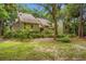 Welcoming home featuring a balcony, landscaped yard, and a two-car garage at 40 Greensward Rd, Kiawah Island, SC 29455
