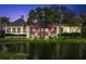 Beautiful building situated next to a pond, featuring lovely balconies and manicured landscaping at 40 Greensward Rd, Kiawah Island, SC 29455