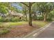 Lovely home featuring mature trees, a well-manicured lawn, and a peaceful neighborhood setting at 40 Greensward Rd, Kiawah Island, SC 29455