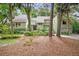Beautiful exterior featuring a lush, wooded homesite and mature trees adding charm at 40 Greensward Rd, Kiawah Island, SC 29455