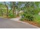 This home boasts mature trees, established landscaping, and a convenient mailbox by the street at 40 Greensward Rd, Kiawah Island, SC 29455