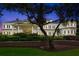 Spacious building with a grand entrance, highlighted by colorful plants and a sturdy brick wall at 40 Greensward Rd, Kiawah Island, SC 29455