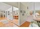 Bright foyer featuring hardwood floors, staircase to the second floor, and views into dining room at 40 Greensward Rd, Kiawah Island, SC 29455