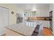 Bright kitchen with stainless steel appliances and a spacious granite-topped island at 40 Greensward Rd, Kiawah Island, SC 29455