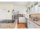 Bright kitchen with stainless steel refrigerator and appliances, and breakfast bar seating at 40 Greensward Rd, Kiawah Island, SC 29455
