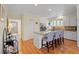 Well-lit kitchen featuring a large island with bar stools and ample cabinet space at 40 Greensward Rd, Kiawah Island, SC 29455
