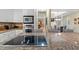 Modern kitchen with a cooktop island featuring stainless steel appliances at 40 Greensward Rd, Kiawah Island, SC 29455