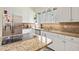 Well lit kitchen with stainless steel refrigerator and appliances and view of cooktop island at 40 Greensward Rd, Kiawah Island, SC 29455