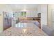 Modern kitchen with white cabinetry, stainless steel appliances, and a large center island at 40 Greensward Rd, Kiawah Island, SC 29455