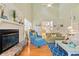 Inviting living room features a fireplace, hardwood floors, and high ceilings at 40 Greensward Rd, Kiawah Island, SC 29455