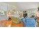 Open-concept living room boasts high ceilings, hardwood floors, and comfortable seating arrangement at 40 Greensward Rd, Kiawah Island, SC 29455