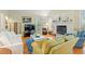 Cozy living room with a fireplace, hardwood floors, and comfortable seating arrangement at 40 Greensward Rd, Kiawah Island, SC 29455