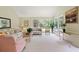 Bright and spacious living room featuring multiple windows and stylish decor at 40 Greensward Rd, Kiawah Island, SC 29455