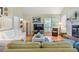Bright living room featuring light-colored walls, hardwood floors, and comfortable seating arrangement at 40 Greensward Rd, Kiawah Island, SC 29455