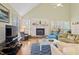 Warm living room featuring a fireplace, hardwood floors, and comfortable seating at 40 Greensward Rd, Kiawah Island, SC 29455