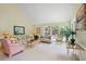 Bright and spacious living room featuring multiple windows and comfortable chairs at 40 Greensward Rd, Kiawah Island, SC 29455