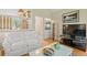 Upstairs living room with bright walls, modern screen, and comfortable white sofa at 40 Greensward Rd, Kiawah Island, SC 29455