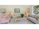 Bright living room featuring comfortable seating, a coffee table, and large windows at 40 Greensward Rd, Kiawah Island, SC 29455