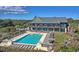 Stunning aerial view of a pool with sundeck and multiple seating areas, ideal for outdoor entertainment at 40 Greensward Rd, Kiawah Island, SC 29455