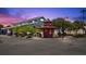 Charming town center at dusk with shops and inviting outdoor spaces for an idyllic neighborhood atmosphere at 40 Greensward Rd, Kiawah Island, SC 29455
